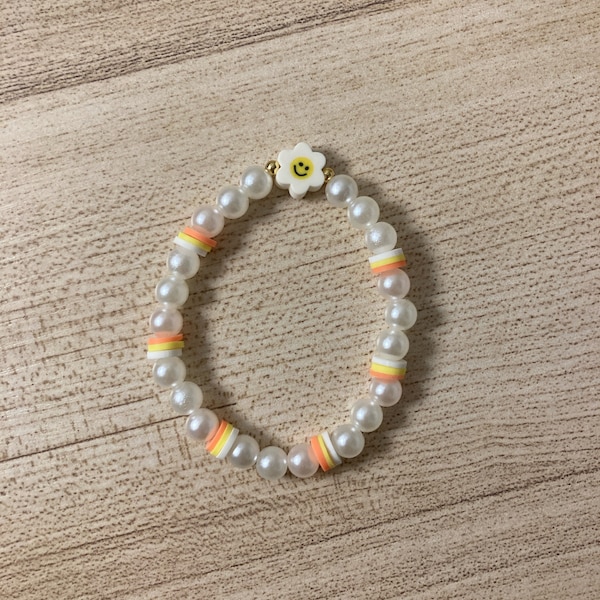 Stylish candy corn pearl bracelet + FREE sticker. Fits any girls wrist. Trendy fashion accessory. FREE SHIPPING!