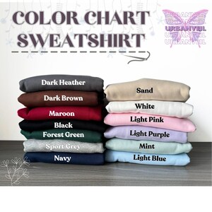May include: Colour chart displaying various sweatshirt colours, including dark heather, dark brown, maroon, black, forest green, sport grey, navy, sand, white, light pink, light purple, mint, and light blue.