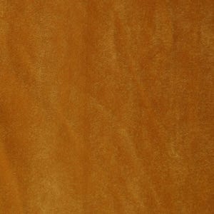 May include: A close-up of a smooth, textured fabric in a rich, warm brown color. The fabric has a subtle sheen and a slightly velvety feel.