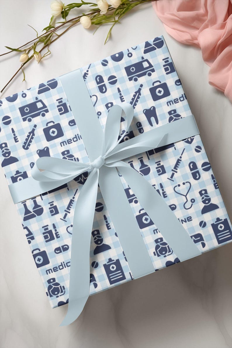 Blue and white wrapping paper with a medical theme. The paper features a variety of medical symbols, including a stethoscope, a syringe, a pill bottle, a thermometer, and a first aid kit. The paper also includes the word "medicine" repeated throughout. Wrapping Paper for Healthcare Workers - Ambulance Stethoscope Medicine Pills Pattern, Doctor's Graduation Present Wrap, Medical Staff Gift