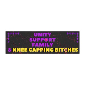 May include: A rectangular graphic with a black background and a splatter effect. The text "UNITY SUPPORT FAMILY & KNEE CAPPING BITCHES" is displayed in purple and yellow. Small purple skull icons are on the top and bottom.