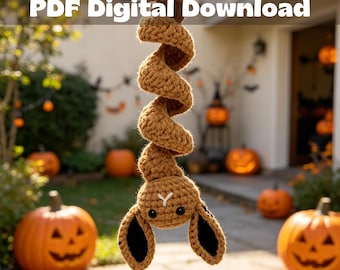 May include: A brown crochet hanging decoration featuring a spiral body and a head with two long ears, black eyes, and a white stitched nose. The text Crochet Pattern PDF Digital Download is displayed at the top of the image.