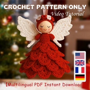 May include: A red crochet angel decoration with white wings and a wooden head. The angel wears a red dress and a floral crown. The image includes the text "CROCHET PATTERN ONLY Video Tutorial" at the top.