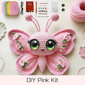 May include: A DIY pink crochet kit featuring a pink butterfly with large green eyes and floral accents. The kit includes yarn, crochet hooks, safety eyes, and other craft supplies. The text "DIY Pink Kit" is at the bottom.
