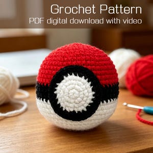 May include: A crocheted ball in red, black, and white, resembling a popular character. The ball is on a wooden surface, with yarn and a crochet hook nearby. The text "Crochet Pattern PDF digital download with video" is at the top.
