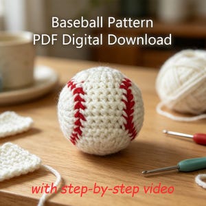 May include: A crocheted baseball with white yarn and red stitching details. The text Baseball Pattern PDF Digital Download and with step-by-step video is visible. The object is displayed alongside white yarn balls and crochet hooks.