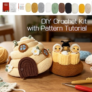 May include: A DIY crochet kit featuring a beige beehive-shaped structure with a brown door and floral accents, alongside a yellow honeycomb base containing three small crocheted figures. Includes various yarn skeins, a hook, and accessories.