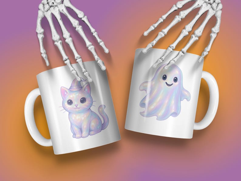 May include: Two white ceramic mugs with Halloween designs. One mug shows a cute cat in a witch's hat, the other a friendly ghost. The mugs are held by a skeleton hand against a gradient background.