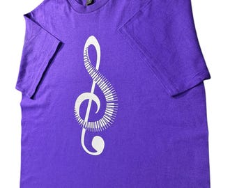 Purple Graphic T-Shirt with White Treble Clef Piano Keys Design, Music Lover Short Sleeve Tee