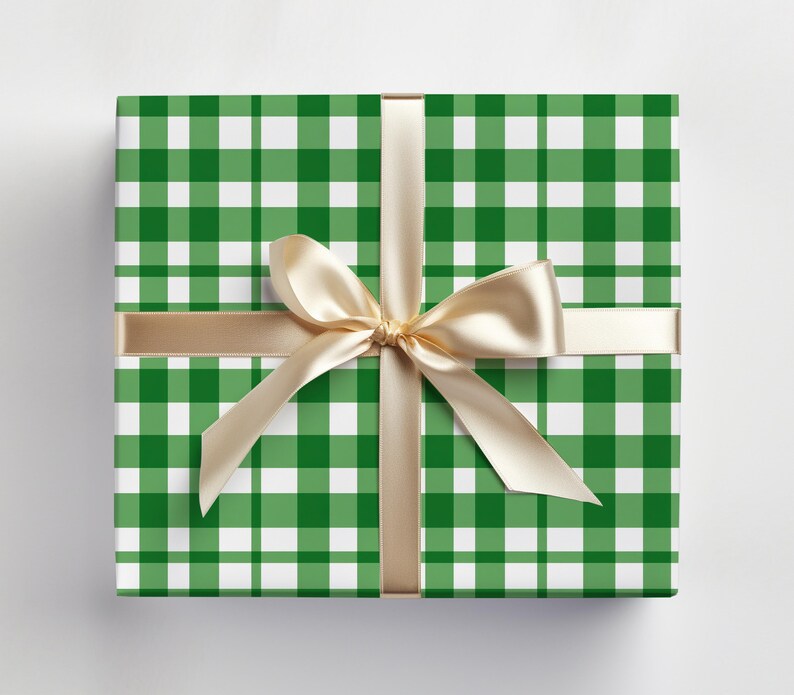 May include: A green and white gingham gift box with a gold ribbon tied in a bow.