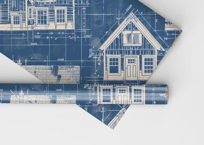 May include: Blue and white blueprint style wrapping paper with a repeating pattern of house plans. The paper is rolled up and partially unrolled, showing the design.