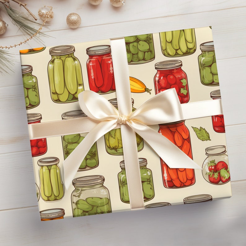 May include: A cream-colored gift wrap with a repeating pattern of jars filled with green pickles, red peppers, and other vegetables. The jars are tied with a white ribbon with a bow.