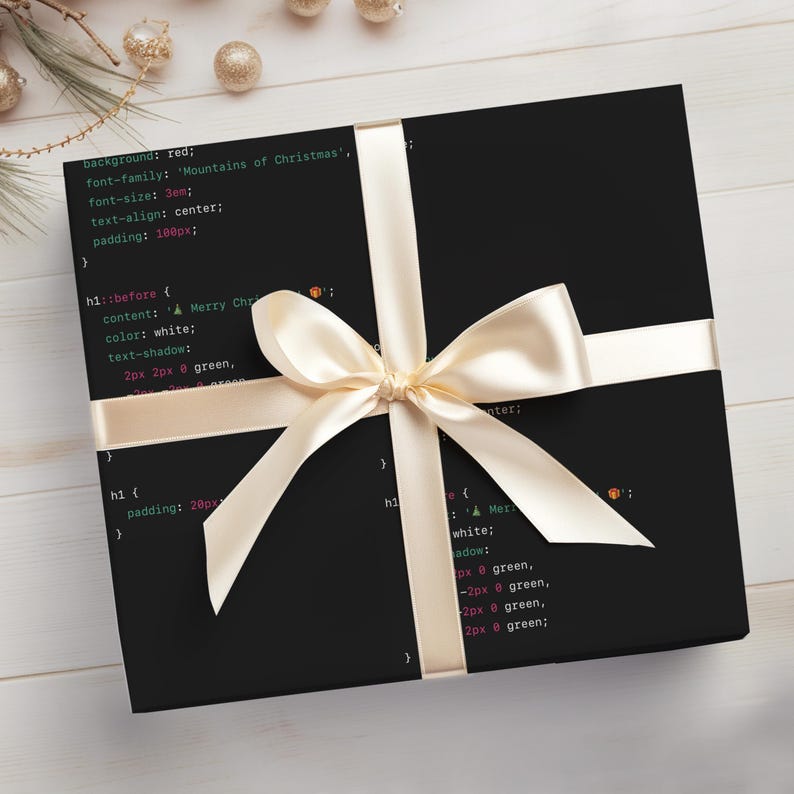 May include: A black gift box wrapped in paper with code printed on it. The box is tied with a white satin ribbon and bow. The code reads: "background: red; font-family: 'Mountains of Christmas'; font-size: 3em; text-align: center; padding: 100px; hi::before { content: A Merry Christmas; color: white; text-shadow: 2px 2px 8 green, 2px -2px 8 green, -2px 2px 8 green, -2px -2px 8 green; } h1 { padding: 20px } h1::after { content: A Merry Christmas; color: white; text-shadow: 2px 2px 8 green, 2px -2px 8 green, -2px 2px 8 green, -2px -2px 8 green; }"