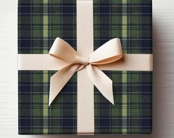 May include: A wrapped gift box with a green and navy plaid pattern. A cream-colored ribbon is tied in a bow around the box. The gift box is on a white surface.