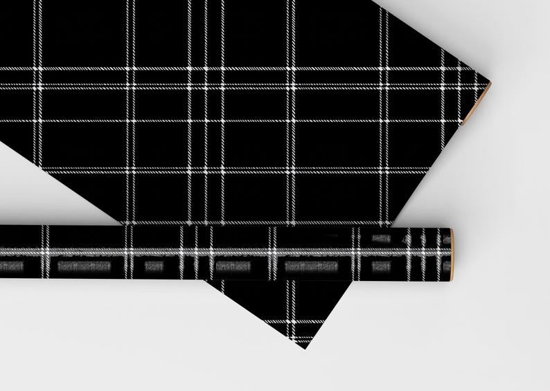 May include: Black and white plaid wrapping paper. The paper is rolled up and the end is visible.