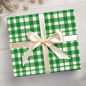 May include: A green and white gingham gift box with a cream-colored ribbon and bow.