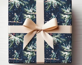 May include: A wrapped gift with navy blue wrapping paper featuring a winter ski scene with skiers, snow, and evergreen branches. The gift is tied with a beige ribbon and bow.