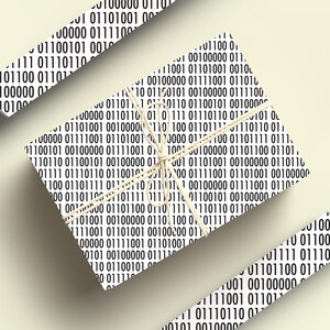 May include: Wrapping paper featuring a repeating pattern of black and white binary code. The wrapped gift is tied with string. Additional pieces of the same paper are scattered around the gift.