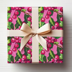 May include: Pink gift wrap with a white ribbon and a pattern of green holly leaves and red berries.