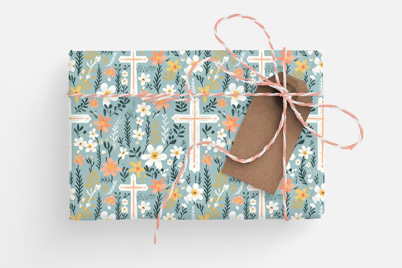 May include: A gift wrapped in blue floral wrapping paper with white crosses and a brown gift tag tied with twine.