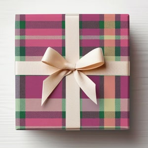 May include: A gift box wrapped in pink, green, and cream plaid wrapping paper with a cream satin ribbon tied in a bow.