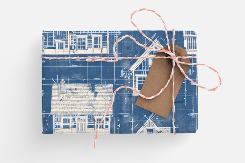 May include: A gift wrapped in blue and white patterned paper with a brown tag tied with a pink and white twine. The paper features a repeating pattern of house blueprints.