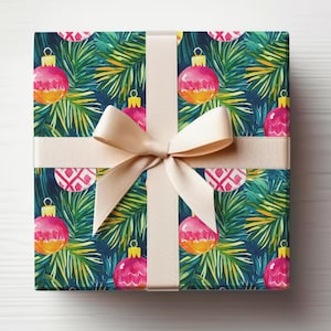 May include: A wrapped gift with festive wrapping paper featuring a pattern of pink and orange Christmas baubles and green pine needles on a dark blue background. A beige ribbon is tied in a bow around the gift.