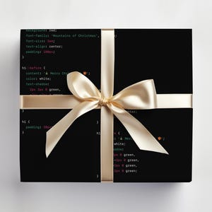 May include: A black box wrapped in a gold ribbon with a bow. The box is covered in code, with the text "background: red; font-family: 'Mountains of Christmas'; font-size: 3em; text-align: center; padding: 100px; h1::before { content: A Merry Christmas; color: white; text-shadow: 2px 2px 0 green, 2px -2px 0 green, -2px 2px 0 green, -2px -2px 0 green; } h1 { padding: 20px; } h1 { color: white; text-shadow: 2px 2px 0 green, 2px -2px 0 green, -2px 2px 0 green, -2px -2px 0 green; }"
