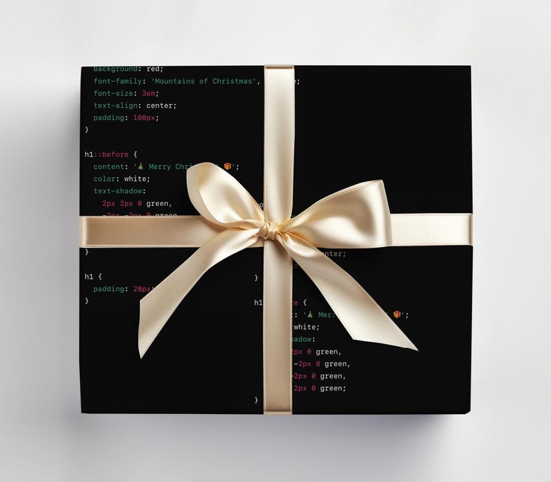 May include: A black box wrapped in a gold ribbon with a bow. The box is covered in code, with the text "background: red; font-family: 'Mountains of Christmas'; font-size: 3em; text-align: center; padding: 100px; h1::before { content: A Merry Christmas; color: white; text-shadow: 2px 2px 0 green, 2px -2px 0 green, -2px 2px 0 green, -2px -2px 0 green; } h1 { padding: 20px; } h1 { color: white; text-shadow: 2px 2px 0 green, 2px -2px 0 green, -2px 2px 0 green, -2px -2px 0 green; }"