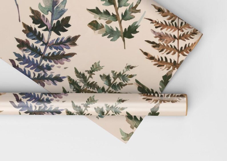 May include: A roll of wrapping paper with a watercolor fern pattern in shades of brown, green, and blue on a cream background.