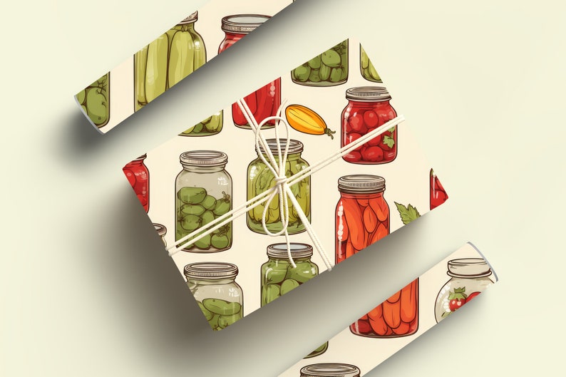 May include: A gift wrapped in white paper with a pattern of various jars of preserved vegetables and fruits. The jars are filled with green beans, tomatoes, peppers, and carrots. The gift is tied with a white ribbon.