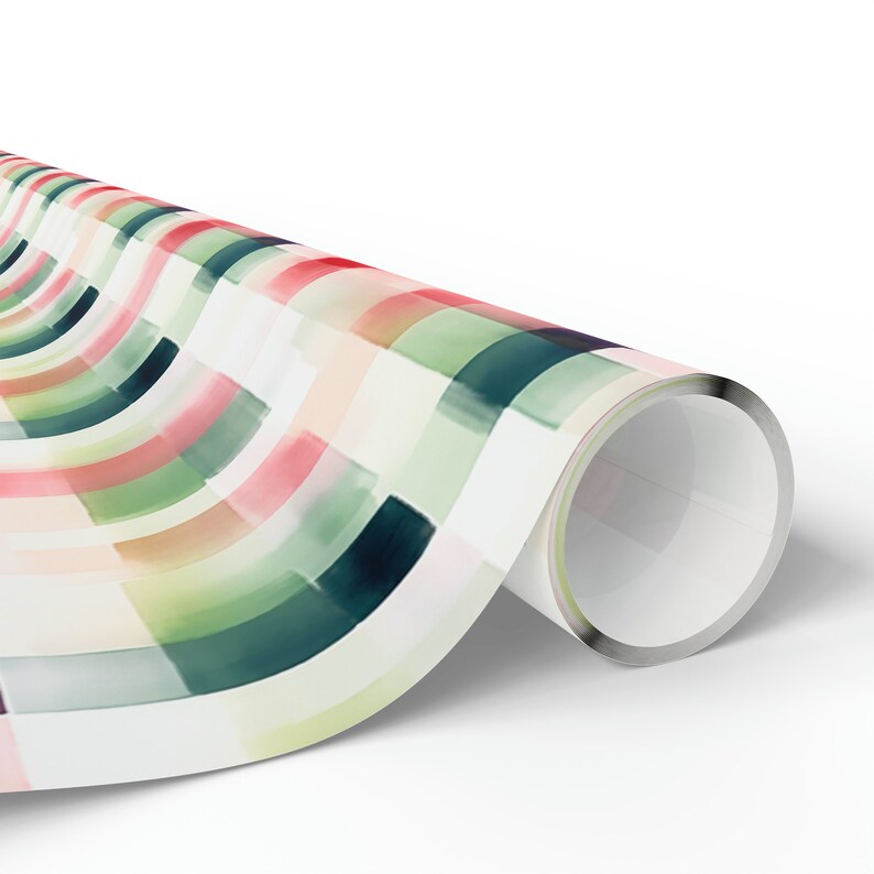May include: A roll of wrapping paper with a colorful geometric pattern. The pattern features alternating stripes of green, pink, and yellow, with a white background.