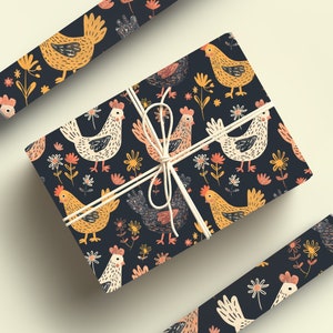 May include: A gift wrapped in dark blue wrapping paper with a repeating pattern of yellow, white, and orange chickens and flowers. The paper is tied with a white string.