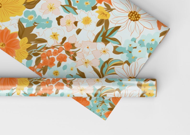May include: A roll of white wrapping paper with a floral pattern in shades of orange, yellow, blue, and brown. The paper is rolled up and the end is visible.