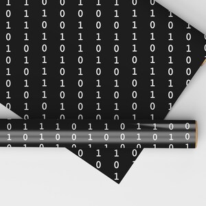May include: Two rolls of black wrapping paper with a white binary code pattern. The paper is rolled up and the ends are visible.