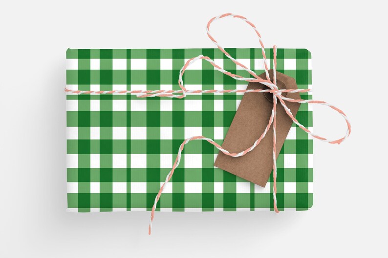 May include: A green and white gingham gift box tied with twine and a brown gift tag.