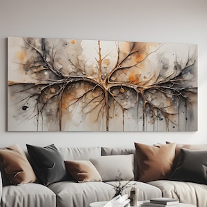 May include: A large abstract painting of a tree with brown branches and a white background. The painting is hanging on a wall in a living room with a white couch and a coffee table.