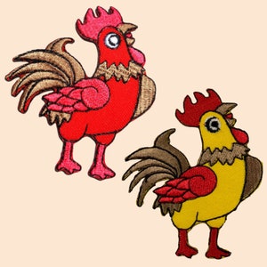 May include: Two embroidered iron-on patches of roosters. One rooster is red with brown feathers and the other is yellow with brown feathers.
