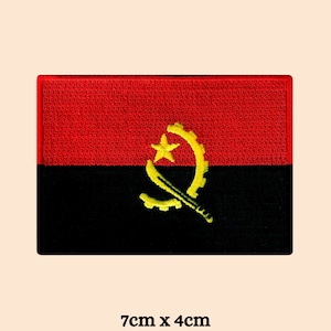 May include: A red, black, and yellow embroidered patch of the Angolan flag. The flag features a yellow star and a yellow symbol of a machete and a half-moon. The patch is 7 cm by 4 cm.