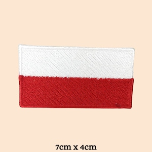 May include: An embroidered patch of the Polish flag, featuring white and red colours. The patch measures 7cm by 4cm.