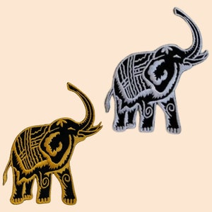 May include: Two embroidered iron-on patches of elephants. One elephant is black and gold, the other is black and white.