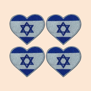 May include: Four heart-shaped embroidered patches featuring the Israeli flag. Each patch has a blue Star of David on a white background with two blue stripes.