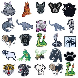 May include: A collection of embroidered patches featuring various animals. The patches include cats, dogs, snakes, a spider, a bear, a frog, a bee, a tiger, and a panther. Each patch is detailed with vibrant colors and intricate stitching, suitable for clothing or accessories.