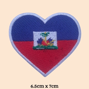 May include: Heart-shaped embroidered patch featuring the Haitian flag design. The patch is divided into blue and red sections, with the Haitian coat of arms in the center. The patch measures 6.5cm x 7cm.
