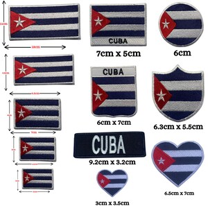 May include: A collection of embroidered patches featuring the Cuban flag in various shapes including rectangles, circles, shields, and hearts. Several patches include the text CUBA. Dimensions are provided in centimetres for each item.