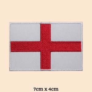 May include: White embroidered patch with a red cross, representing the flag of England. The patch measures 7 inches by 4 inches.