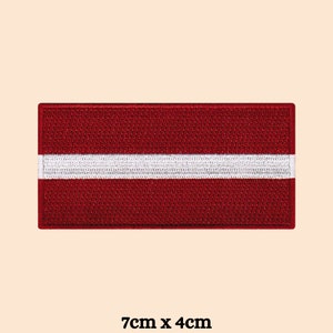 May include: Embroidered patch of the Latvian flag. The flag is red with a white horizontal stripe in the center. The patch measures 7 inches by 4 inches.