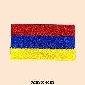 May include: Embroidered patch featuring the Armenian flag, a horizontal tricolor of red, blue, and yellow. The patch measures 7cm x 4cm, or approximately 2.75 inches by 1.5 inches.
