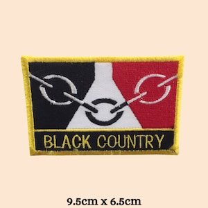 May include: Black and white chain links on a red, white and black flag with a yellow border. The text "BLACK COUNTRY" is below the flag. The patch is 9.5cm by 6.5cm.