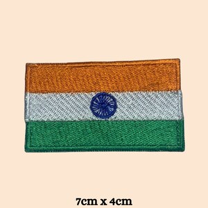 May include: An embroidered Indian flag patch with the colors orange, white, and green. The flag has a blue wheel in the center. The patch is 7 inches by 4 inches.